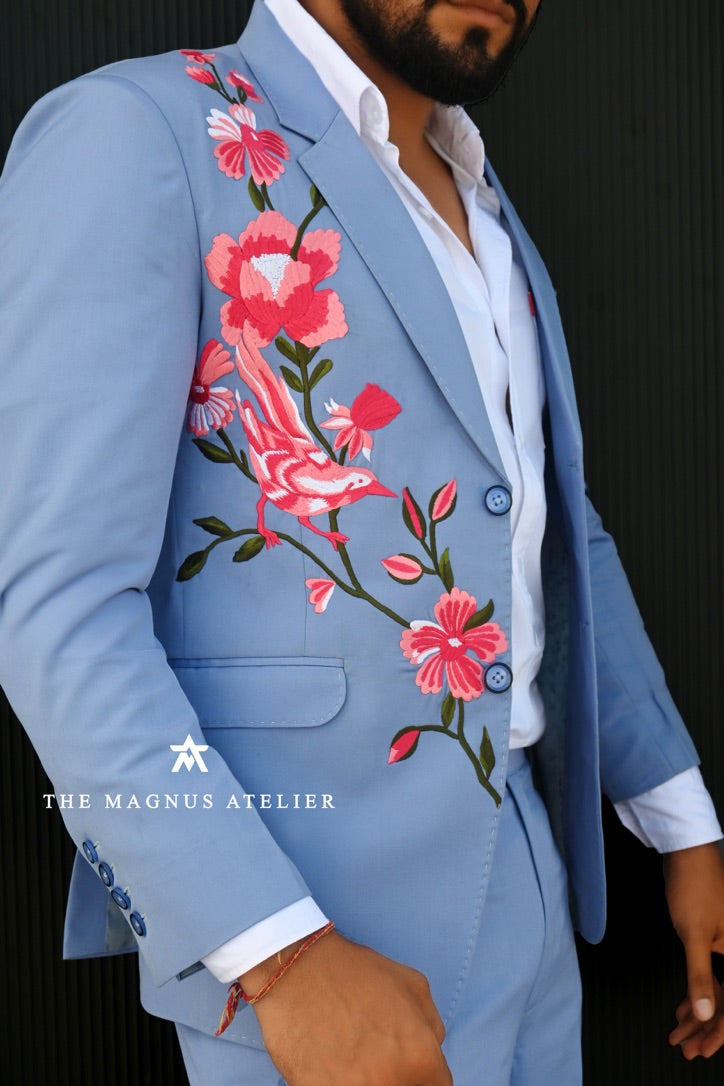 men blue suit detailed close-up picture of embroidery